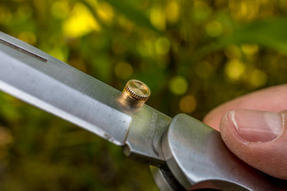 Opening aid for folding knives