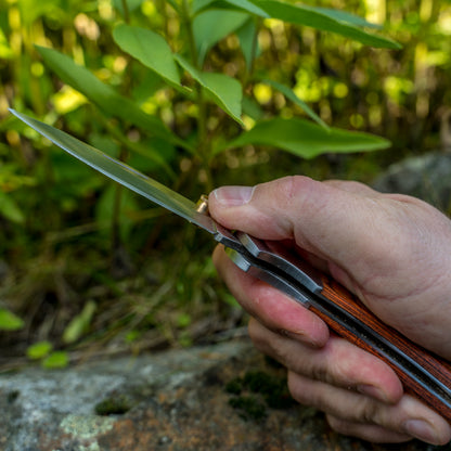 Opening aid for folding knives